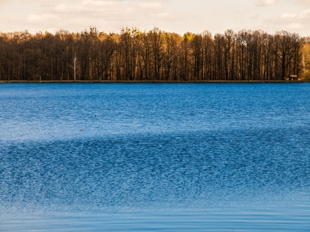 Water and trees in autumn timeの写真素材