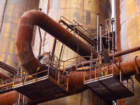 Big rusty pipes in an industrial factory