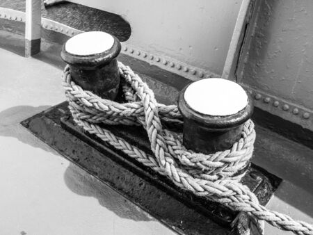 Old mooring bollard on the ship, in black and whiteの写真素材