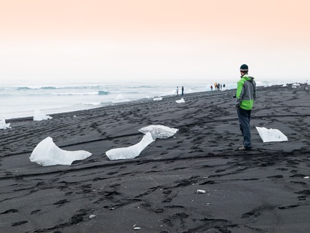 Black beach full of icebergs near Jokulsarlon, Icelandの写真素材