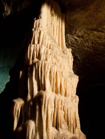 Picturesque karst features illuminated in the caveの写真素材