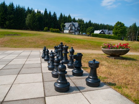 Black figures of giant outdoor chess in the parkの写真素材