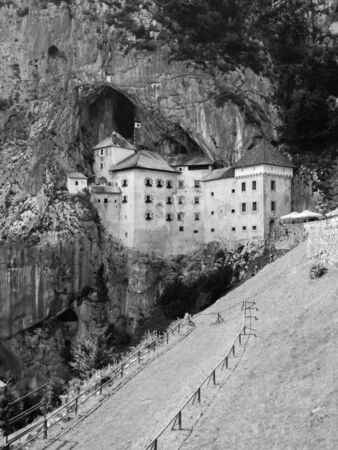 Predjama Castle built in the cave, Slovenia, black and white imageの写真素材