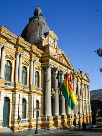 Monumental portal of Government Palace with bolivian flag above it, La Paz, Boliviaの写真素材