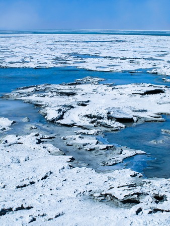 Blue water flowing from hot spring between many borax islands, Boliviaの写真素材