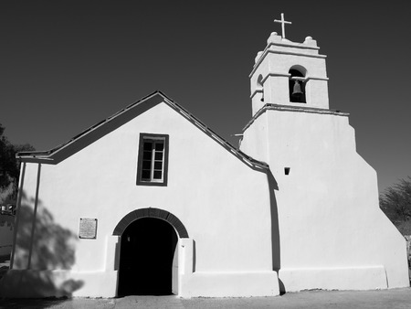 Little white colonial church of St. Peter, San Pedro de Atacama, Chile. Black and white image.の写真素材