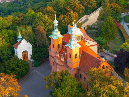 Baroque church of Saint Vavrinec or Lawrence with pink facade on Petrin Hill in Prague, Czech Republicの写真素材
