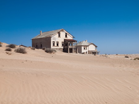 Kolmanskop Ghost Town near old diamond mines in southern Namibia with devasted houses filled with sand.の写真素材
