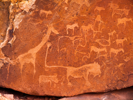 Prehistoric Bushman engravings - Lion Plate with Lion Man and other animals and symbols, Twyfelfontein, Namibiaの写真素材