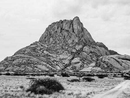 Spitzkoppe mountain - bald granite peak in Namibia. Black and white image.の写真素材