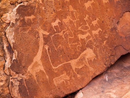 Prehistoric Bushman engravings - Lion Plate with Lion Man and other animals and symbols, Twyfelfontein, Namibiaの写真素材