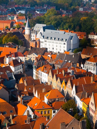 Aerial view of narrow streets and red rooftops of Bruges, Belgiumの写真素材
