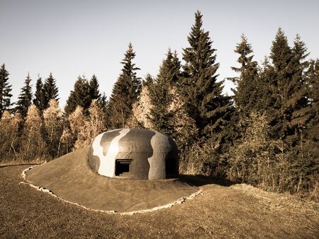 Loopholes in a turret for machine guns with camouflage paintings on military bunker, Fort Hanicka, Czech Republicの写真素材