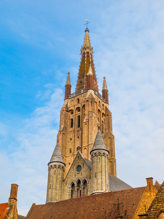 Gothic tower of Church of Our Lady in Bruges is the second tallest brickwork tower in the world.の写真素材