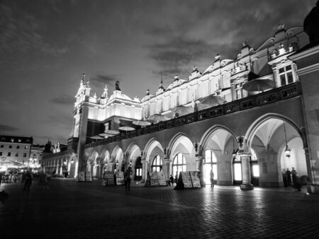Cloth Hall, or Sukiennice, on Main Market Square in the Old Town by night, Krakow, Poland. Black and white image.の写真素材