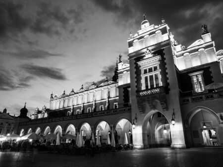 Cloth Hall, or Sukiennice, on Main Market Square in the Old Town by night, Krakow, Poland. Black and white image.の写真素材