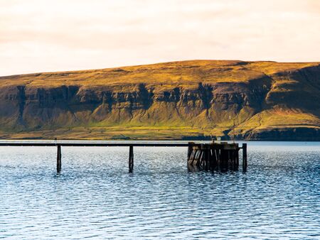 Wooden pier and panorama of western fjord, Icelandの写真素材