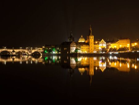 Vltava River with Charles Bridge, Mlynec and Old Town Water Tower by night, Prague, Czech Republicの写真素材