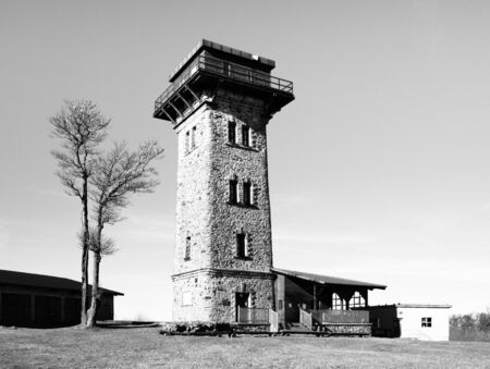 Kurz's tower, tourist lookout tower on the summit of Cerchov Mountain, Czech Republic. Black and white image.の写真素材