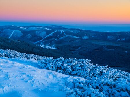 Dramatic dusk in winter mountains, Giant Mountains, Czech Republicの写真素材