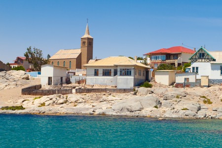 Houses and church of Luderitz on the coast on sunny day, souhtern Namibia, Africa.の写真素材