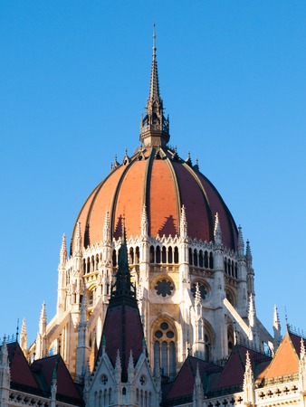 Detailed view of historical building of Hungarian Parliament, aka Orszaghaz, with typical central dome on clear blue sky background. Budapest, Hungary, Europe. It is notable landmark and seat of the National Assembly of Hungary. UNESCO World Heritage Siteの写真素材