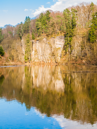 Sandstone rock formations reflected in the water. Plakanek Valley in Bohemian Paradise, aka Cesky Raj, Czech Republic, Europe.の写真素材