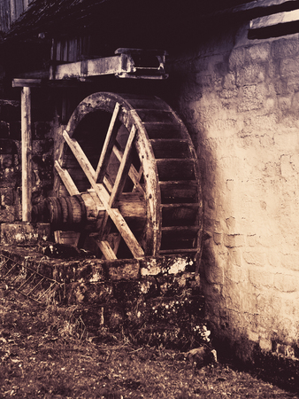 Old watermill wheel. Historical construction in rural region. Vintage style image.の写真素材