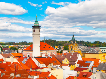 Aerial view of red rooftops with White Tower of Domazlice on sunny day, Czech Republic.の写真素材