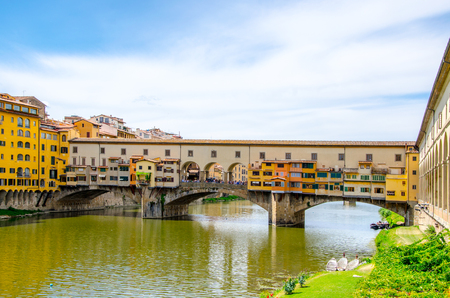 Ponte Vecchio, Old Bridge, medieval stone arch bridge over the Arno River and with many small shops along it, Florence, Tuscany, Italy, Europe. UNESCO World Heritage Siteの写真素材