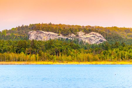 Sandstone rock formations hidden in the forest near Komarov pond, Bohemian Paradise, Czech Republic.の写真素材