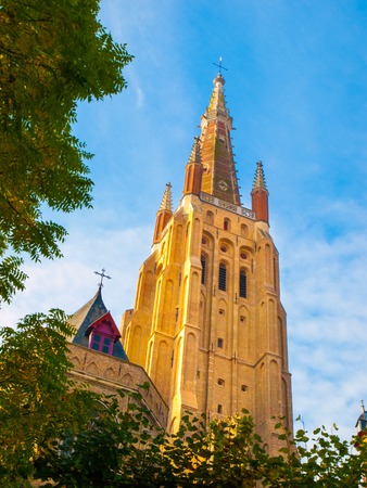 Medieval Church of Our Lady in Bruges on sunny day, Belgium.の写真素材