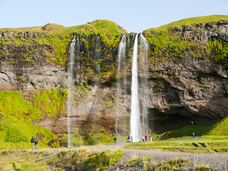 Seljaland Waterfall, aka Seljalandsfoss, front view on sunny day in Icelandの写真素材