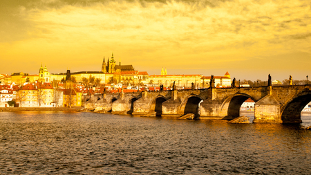 Prague Hradcany Panorama on golden sunny day. Charles Bridge over Vltava River with Prague Castle, Czech Republic.の写真素材