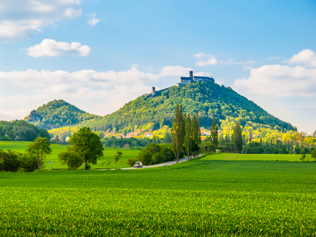 Medieval castle Bezdez on the mountain top. Sunny summer day with lush green fields in Czech landscape. Czech Republic.の写真素材