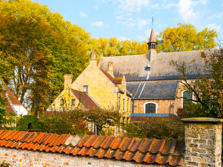 Old houses and chapel of Begijnhof, aka Beguinage, in Bruges, Belgium.の写真素材