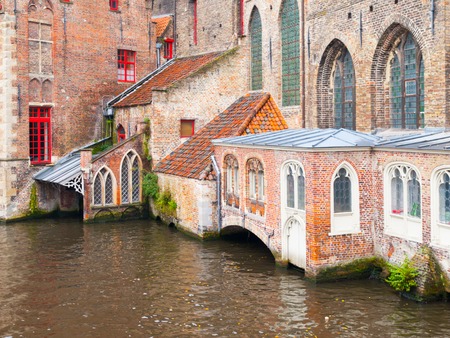Water canal at Old Saint Johns Hospital, Bruges, Belgium.の写真素材