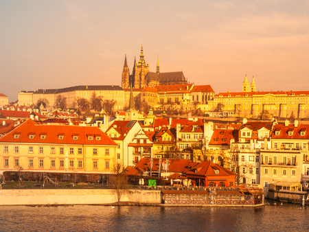 Prague Castle and Vltava River illuminated by golden sunrise, Prague, Czech Republic.の写真素材