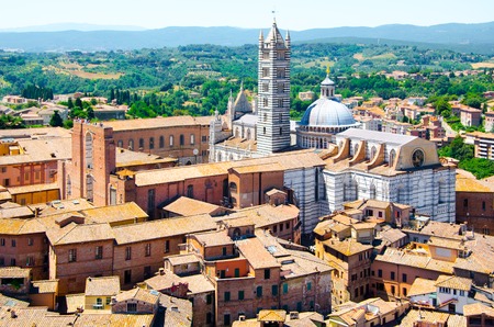 Metropolitan Cathedral of Saint Mary of the Assumption in Siena, aka Duomo di Siena, Tuscany region, Italy, Europe. Aerial view from Torre del Mangia.の写真素材