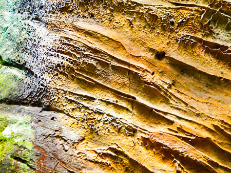 Sandstone texture with colorful ornments made by iron.
