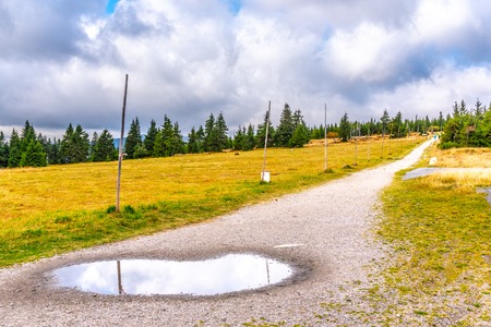Tourist road in the middle of mountain landscape, Giant Mountains, Krkonose, Czech Republic.の写真素材