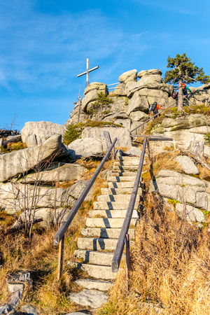Granite rock formation with wooden cross on the top of Hochstein near Dreisesselberg, Tristolicnik. Border between Bayerische Wald in Germany and Sumava National Park in Czech Republic.の写真素材