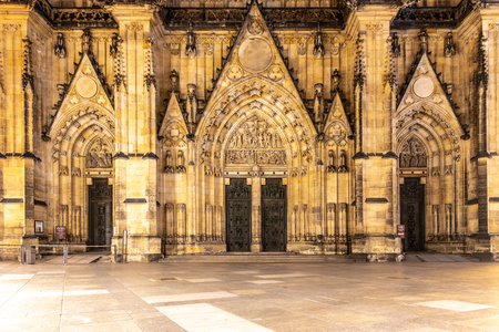 Front view of main entrance to St. Vitus cathedral in Prague Castle by night, Prague, Czech Republic.の写真素材