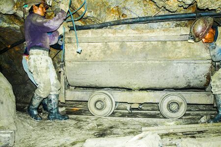 POTOSI, BOLIVIA - JULY 5, 2008: Male miners with carriage in the Cerro Rico mine in Potosi, Bolivia. One of the hardest and most dangerous jobs in the world.のeditorial素材