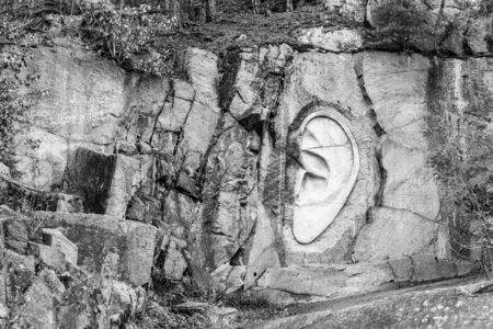 LIPNICE NAD SAZAVOU, CZECH REPUBLIC - DECEMBER 31, 2018: Bretschneiders Ear scuplture in old granite rock quarry near Lipnice Castle. Black and white image.のeditorial素材