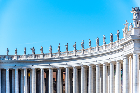 Doric Colonnade with statues of saints on the top. St. Peters Square, Vatican City.の写真素材