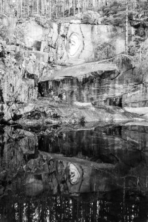 LIPNICE NAD SAZAVOU, CZECH REPUBLIC - DECEMBER 31, 2018: Bretschneiders Ear scuplture in old granite rock quarry near Lipnice Castle. Black and white image.のeditorial素材