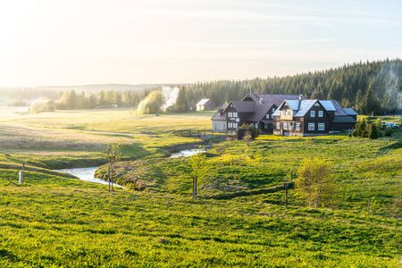 Jizerka village at sunset time. View from Bukovec Mountain, Jizera Mountains, Czech Republic.の写真素材