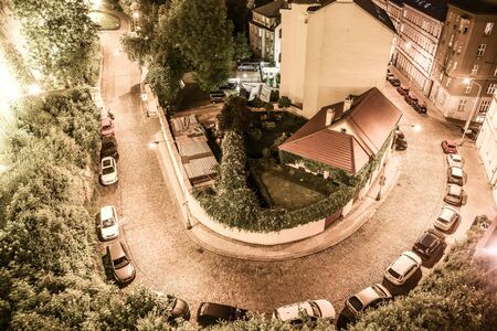 Aerial view of cobbled road sharp curve. Night in Prague city, Czech Republic.の写真素材