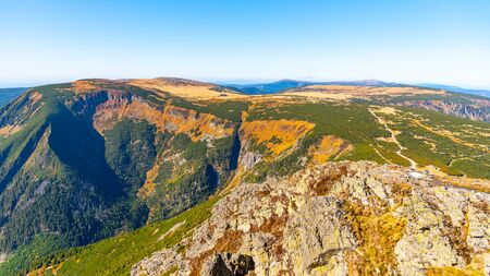 Studnicni Mountain and Giant Valley, Czech: Obri dul, on autumn sunny day in Krkonose - Giant Mountains, Czech Republic. View from lookout point on Snezka Mountain.の写真素材